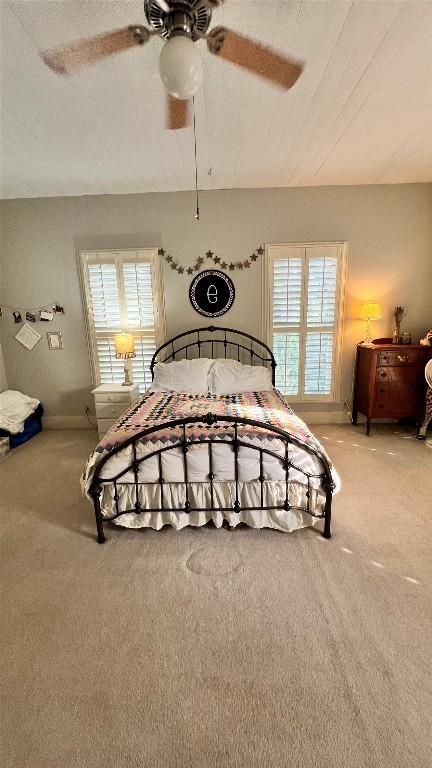 636 Franklin St S, La Grange, TX 78945 - bedroom with light carpet, multiple windows, and a ceiling fan