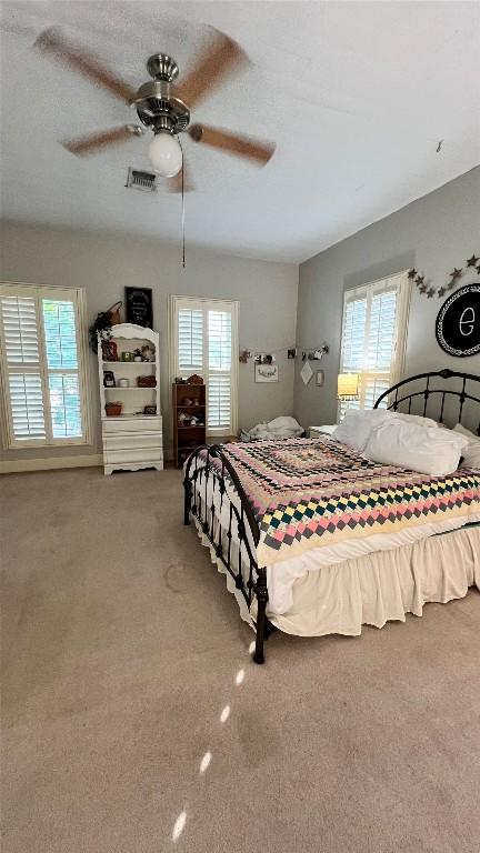 636 Franklin St S, La Grange, TX 78945 - carpeted bedroom featuring ceiling fan