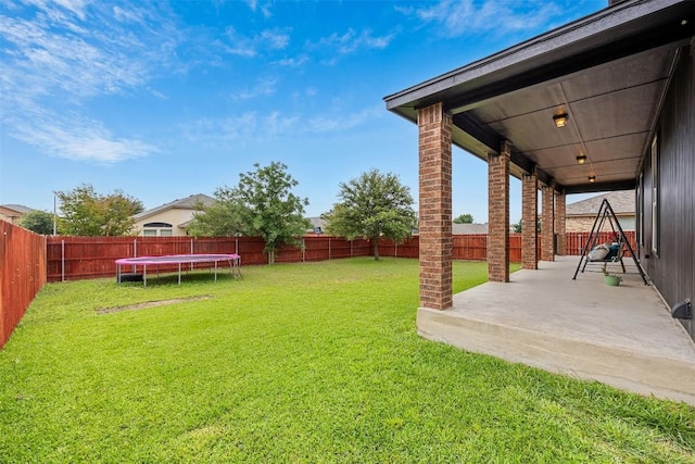1103 Sugar Brook Dr, Temple, TX 76502 - view of yard featuring a trampoline and a patio