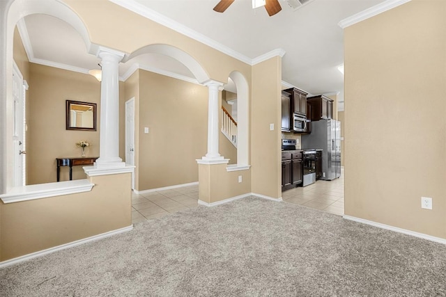 1103 Sugar Brook Dr, Temple, TX 76502 - empty room featuring light colored carpet, light tile patterned flooring, decorative columns, ceiling fan, and crown molding