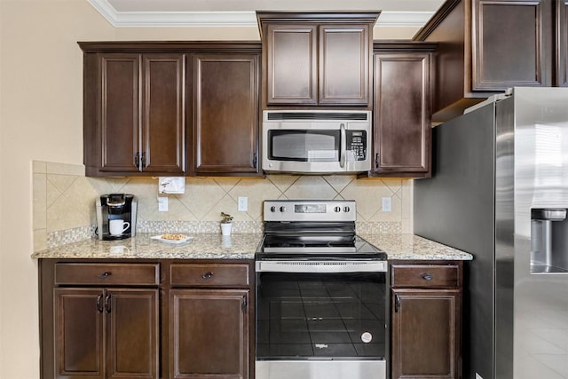 1103 Sugar Brook Dr, Temple, TX 76502 - kitchen with stainless steel appliances, ornamental molding, dark brown cabinetry, light stone counters, and backsplash