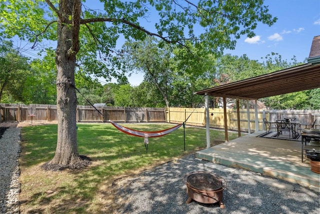 8804 Peppergrass Cv, Austin, TX 78745 - view of yard with an outdoor fire pit and a wooden deck