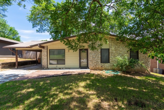 6903 N La Salle Dr, Austin, TX 78723 - mid-century inspired home featuring stone siding, a front yard, cooling unit, and an attached carport