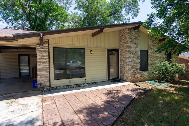 6903 N La Salle Dr, Austin, TX 78723 - doorway to property with stone siding