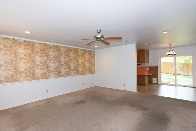 6903 N La Salle Dr, Austin, TX 78723 - unfurnished living room featuring ceiling fan, carpet floors, recessed lighting, and baseboards