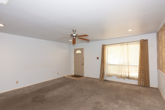6903 N La Salle Dr, Austin, TX 78723 - unfurnished living room with ceiling fan, carpet flooring, and recessed lighting