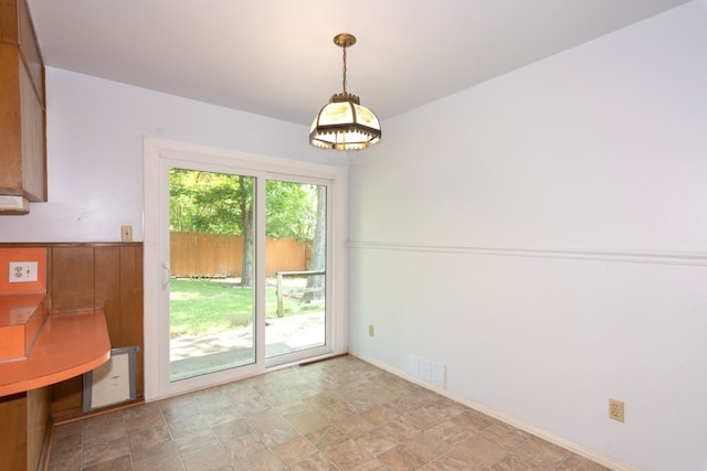 6903 N La Salle Dr, Austin, TX 78723 - unfurnished dining area featuring stone finish flooring