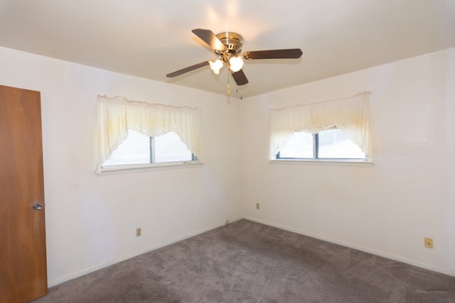 6903 N La Salle Dr, Austin, TX 78723 - unfurnished room featuring healthy amount of natural light, ceiling fan, carpet flooring, and baseboards