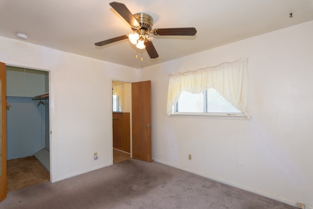 6903 N La Salle Dr, Austin, TX 78723 - unfurnished bedroom with carpet floors, a closet, ceiling fan, and a spacious closet