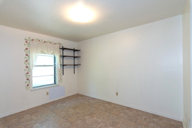 6903 N La Salle Dr, Austin, TX 78723 - unfurnished room with stone finish flooring and baseboards