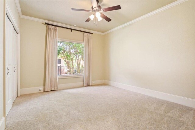 1111 Mill Creek Dr, Salado, TX 76571 - carpeted spare room with ornamental molding and a ceiling fan