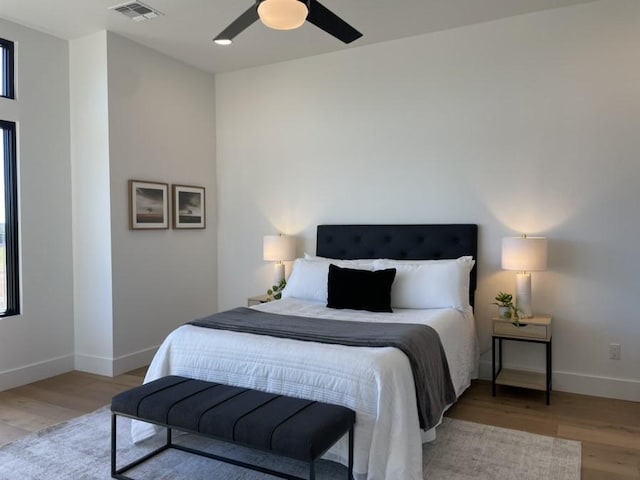 2317 Kahala Sunset Dr, Spicewood, TX 78669 - bedroom featuring light wood finished floors and ceiling fan