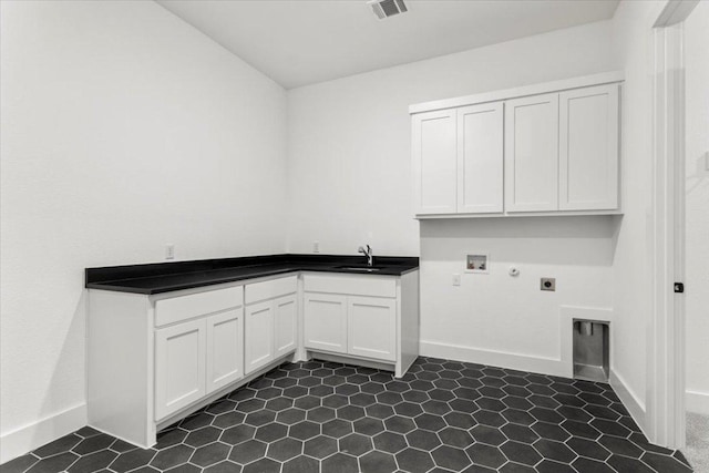 3008 Soldato Way, Leander, TX 78641 - washroom featuring cabinet space, hookup for an electric dryer, and hookup for a washing machine