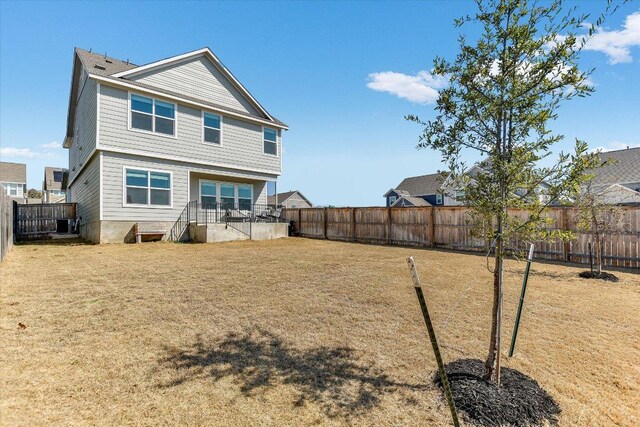 101 Wind Flower Ln, Liberty Hill, TX 78642 - rear view of property with a fenced backyard