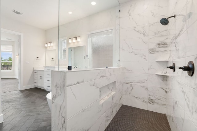 504 Tomichi Trl, Austin, TX 78738 - bathroom featuring walk in shower, vanity, plenty of natural light, baseboards, and recessed lighting