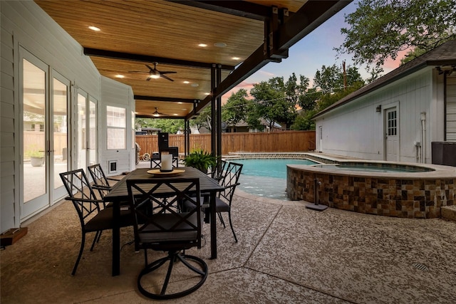 3836 NE Newland Ct, Round Rock, TX 78681 - fenced backyard featuring an in-ground hot tub, outdoor dining space, a patio, ceiling fan, and french doors