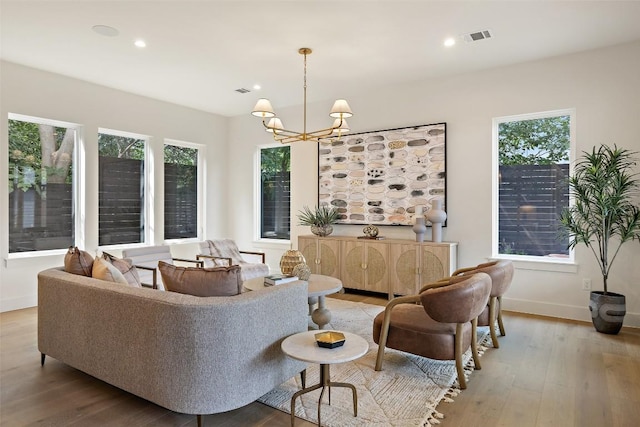 4600 Parkdale Pl Unit 1, Austin, TX 78745 - living room with wood finished floors, plenty of natural light, recessed lighting, and a chandelier