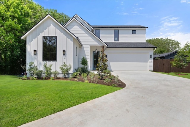 4600 Parkdale Pl Unit 1, Austin, TX 78745 - view of front of home with board and batten siding, driveway, an attached garage, and a shingled roof