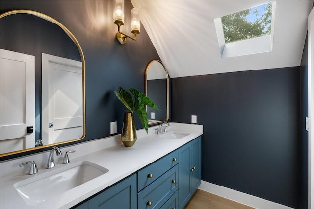 4600 Parkdale Pl Unit 1, Austin, TX 78745 - full bath with a skylight, double vanity, and wood finished floors