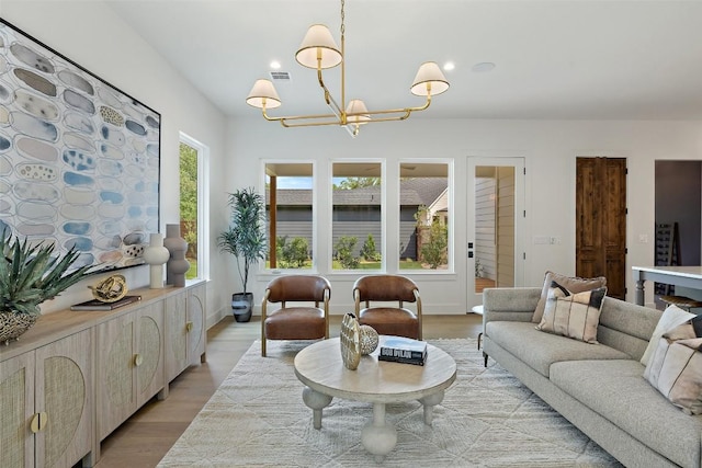 4600 Parkdale Pl Unit 1, Austin, TX 78745 - living area featuring light wood finished floors, a chandelier, and recessed lighting