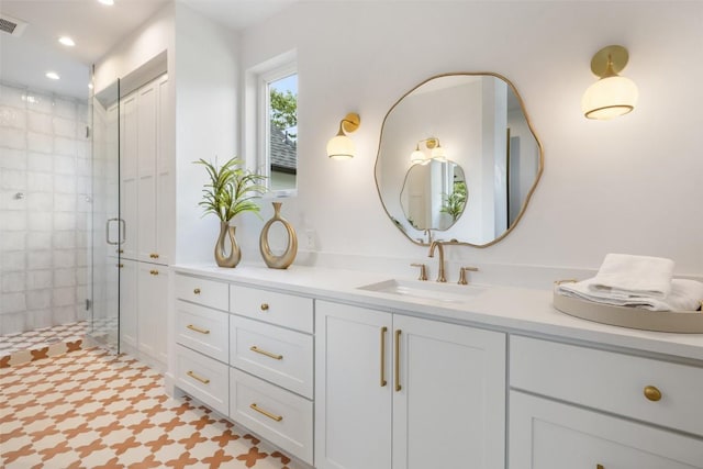 4600 Parkdale Pl Unit 1, Austin, TX 78745 - full bathroom with double vanity, a shower stall, and recessed lighting