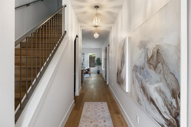 4600 Parkdale Pl Unit 1, Austin, TX 78745 - hallway with wood finished floors, a chandelier, and stairway