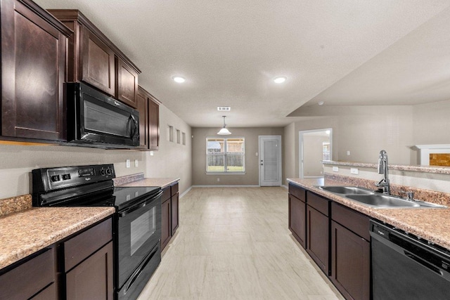 4201 Colonel Dr, Killeen, TX 76549 - kitchen featuring black appliances, dark brown cabinets, light countertops, recessed lighting, and pendant lighting