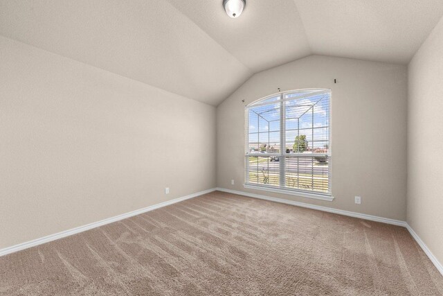 4201 Colonel Dr, Killeen, TX 76549 - spare room with carpet and vaulted ceiling