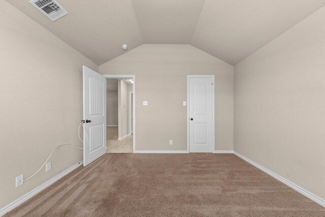 4201 Colonel Dr, Killeen, TX 76549 - unfurnished bedroom featuring carpet and vaulted ceiling