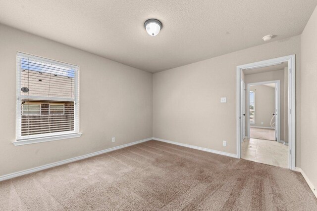 4201 Colonel Dr, Killeen, TX 76549 - carpeted spare room with a textured ceiling and a smoke detector