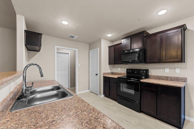 4201 Colonel Dr, Killeen, TX 76549 - kitchen featuring black appliances, dark brown cabinets, recessed lighting, a textured ceiling, and light countertops