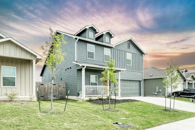 13800 Tordillo Dr, Elgin, TX 78621 - view of front of house featuring board and batten siding, driveway, and an attached garage