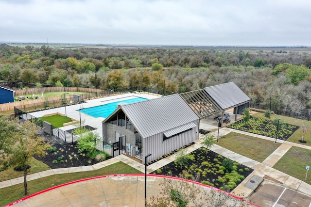13800 Tordillo Dr, Elgin, TX 78621 - aerial view of property's location featuring a heavily wooded area, a pool area, and property parcel outlined