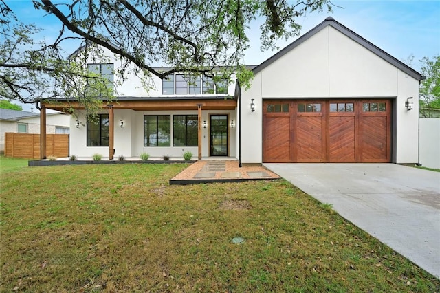 2635 Barton Hills Dr, Austin, TX 78704 - view of front of house with a garage, driveway, and stucco siding