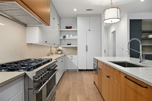 2635 Barton Hills Dr, Austin, TX 78704 - kitchen featuring appliances with stainless steel finishes, premium range hood, open shelves, light wood finished floors, and recessed lighting