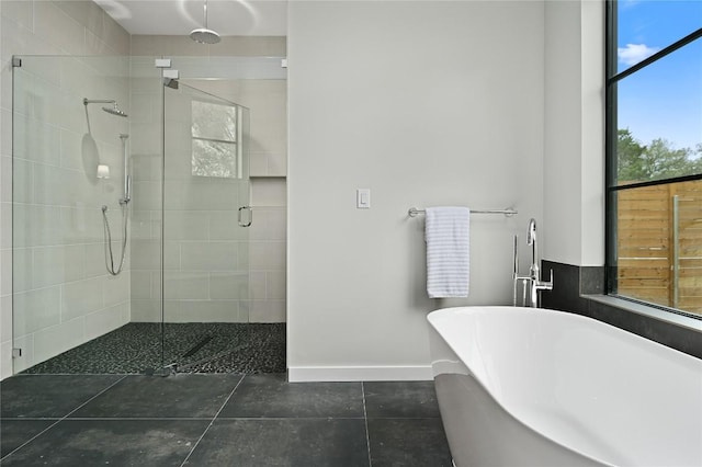 2635 Barton Hills Dr, Austin, TX 78704 - full bathroom featuring a shower stall, a freestanding bath, and tile patterned flooring