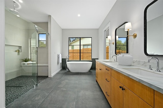 2635 Barton Hills Dr, Austin, TX 78704 - bathroom featuring a shower stall, double vanity, a freestanding tub, recessed lighting, and concrete floors
