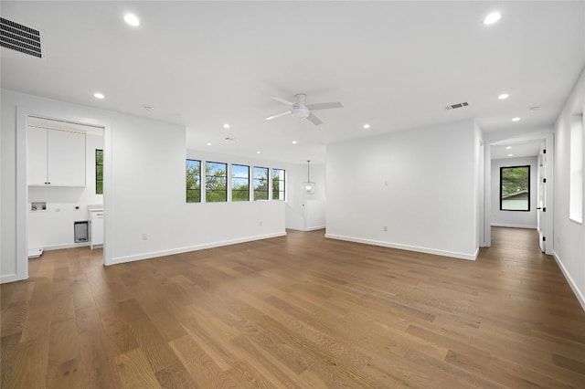 2635 Barton Hills Dr, Austin, TX 78704 - unfurnished living room with a ceiling fan, plenty of natural light, recessed lighting, and wood finished floors