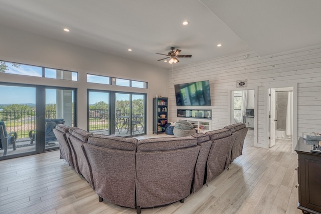 3305 Close Call, Horseshoe Bay, TX 78657 - living room featuring ceiling fan, light wood-style floors, recessed lighting, and wood walls
