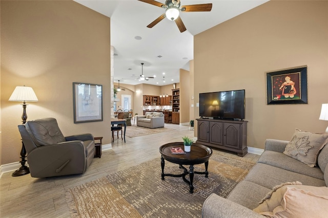 201 Greenridge Ln, Dripping Springs, TX 78620 - living room with a ceiling fan, baseboards, light wood-type flooring, high vaulted ceiling, and recessed lighting