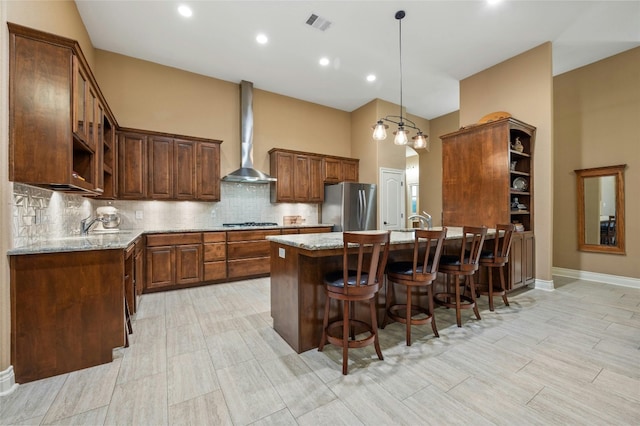 201 Greenridge Ln, Dripping Springs, TX 78620 - kitchen with open shelves, freestanding refrigerator, wall chimney range hood, light stone countertops, and recessed lighting