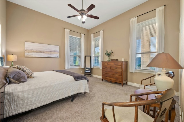 201 Greenridge Ln, Dripping Springs, TX 78620 - carpeted bedroom featuring multiple windows, baseboards, and a ceiling fan