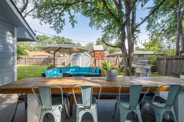 12519 Split Rail Pkwy, Austin, TX 78750 - fenced backyard featuring outdoor dining space, grilling area, and a storage unit