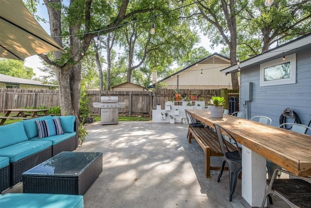 12519 Split Rail Pkwy, Austin, TX 78750 - fenced backyard featuring outdoor dining area, an outdoor hangout area, a patio, and a grill