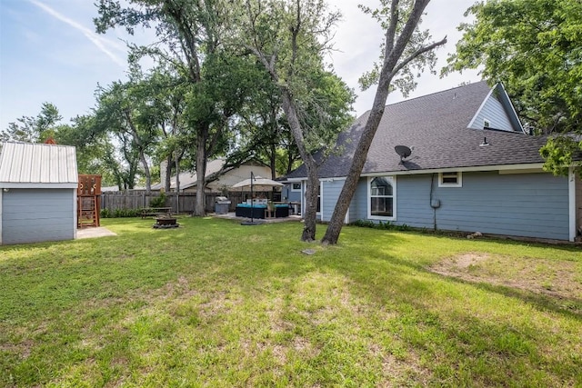12519 Split Rail Pkwy, Austin, TX 78750 - fenced backyard featuring an outdoor fire pit