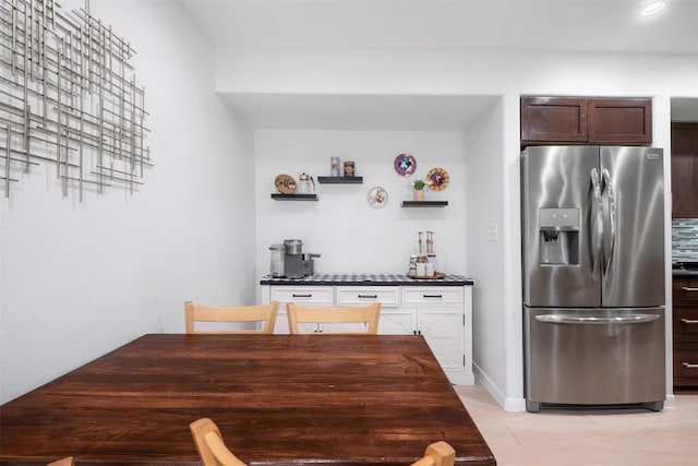 12519 Split Rail Pkwy, Austin, TX 78750 - kitchen featuring stainless steel fridge, open shelves, dark brown cabinetry, and dark countertops