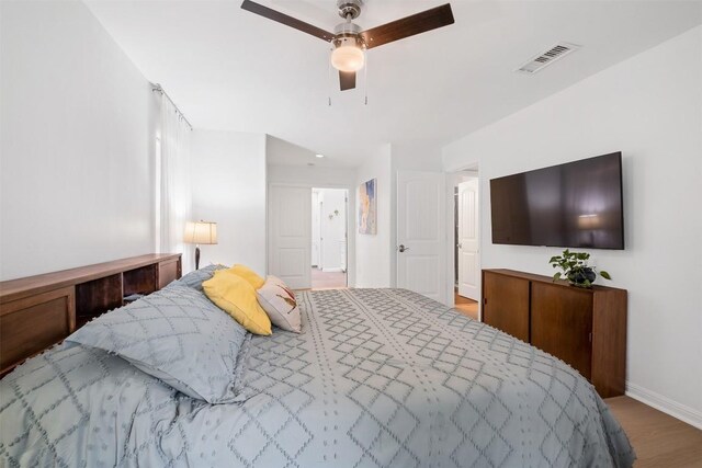 12519 Split Rail Pkwy, Austin, TX 78750 - bedroom with wood finished floors and a ceiling fan