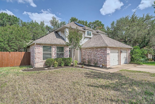8660 Ephraim Rd, Austin, TX 78717 - view of front facade featuring solar panels, a garage, a shingled roof, driveway, and brick siding