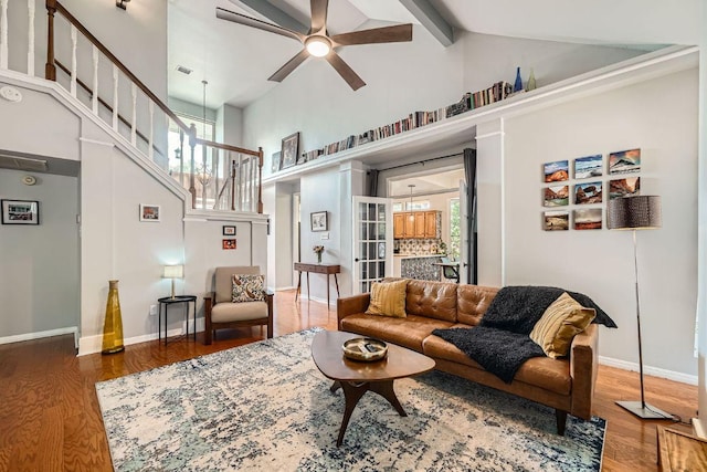 8660 Ephraim Rd, Austin, TX 78717 - living area with high vaulted ceiling, stairs, wood finished floors, a ceiling fan, and beamed ceiling