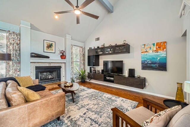 8660 Ephraim Rd, Austin, TX 78717 - living room featuring ceiling fan, high vaulted ceiling, wood finished floors, a fireplace, and baseboards
